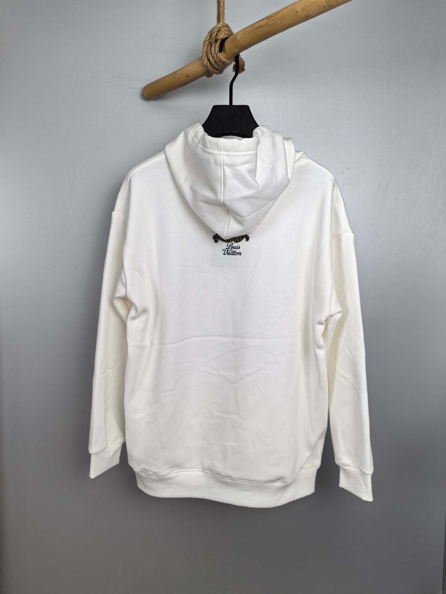 White hoodie with hood and small chest logo, long sleeves