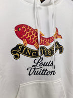 White hoodie chest print featuring colorful fish and Louis Vuitton script