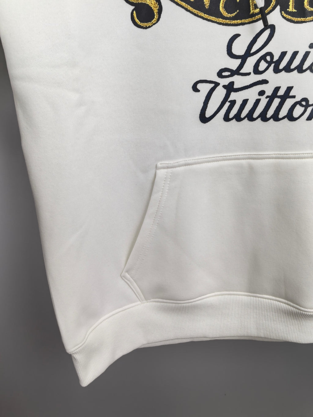 White hoodie front pocket and ribbed hem