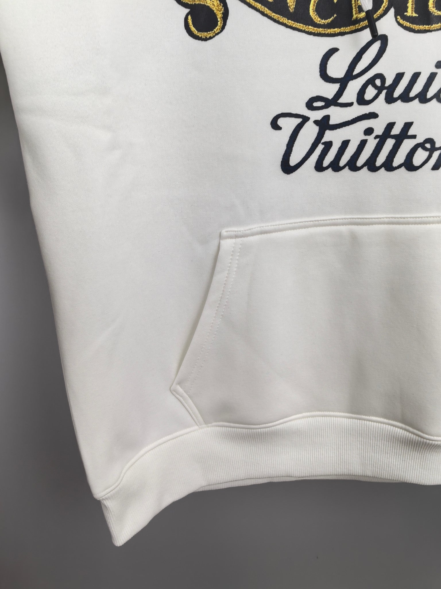 White hoodie front pocket and ribbed hem