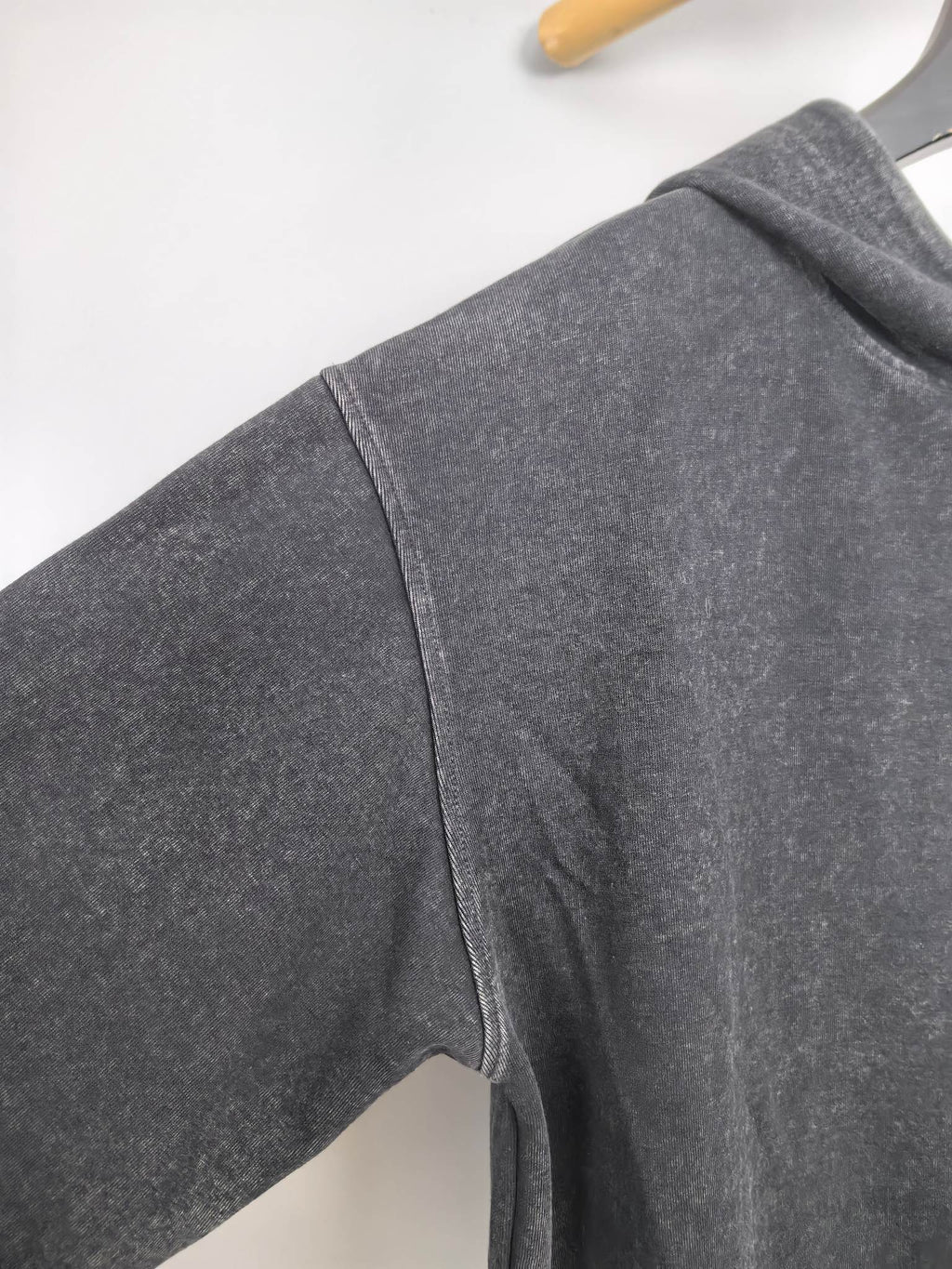Charcoal hoodie sleeve with curved seam and rib cuff