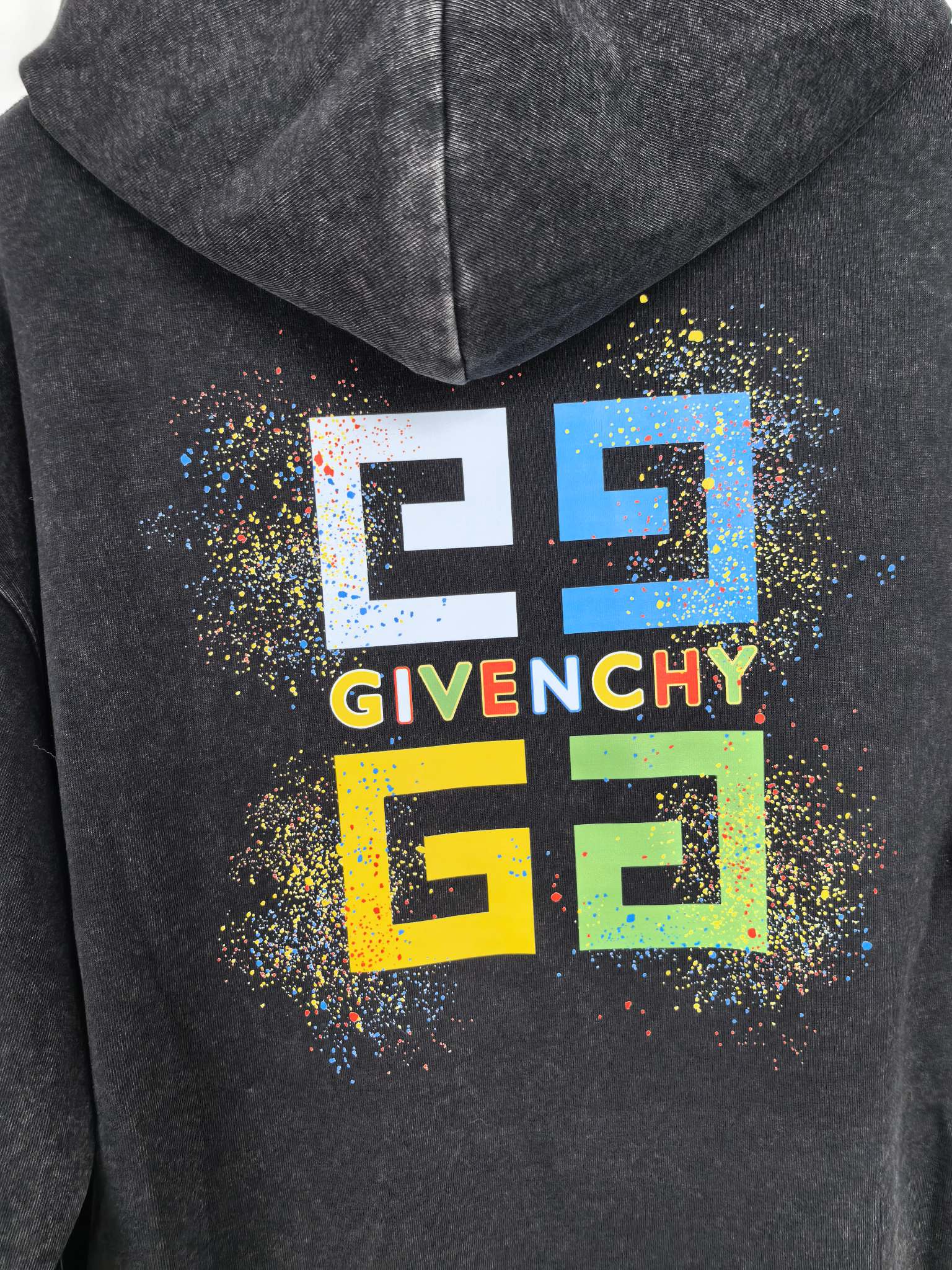 Charcoal hoodie back hood with large Givenchy logo graphic