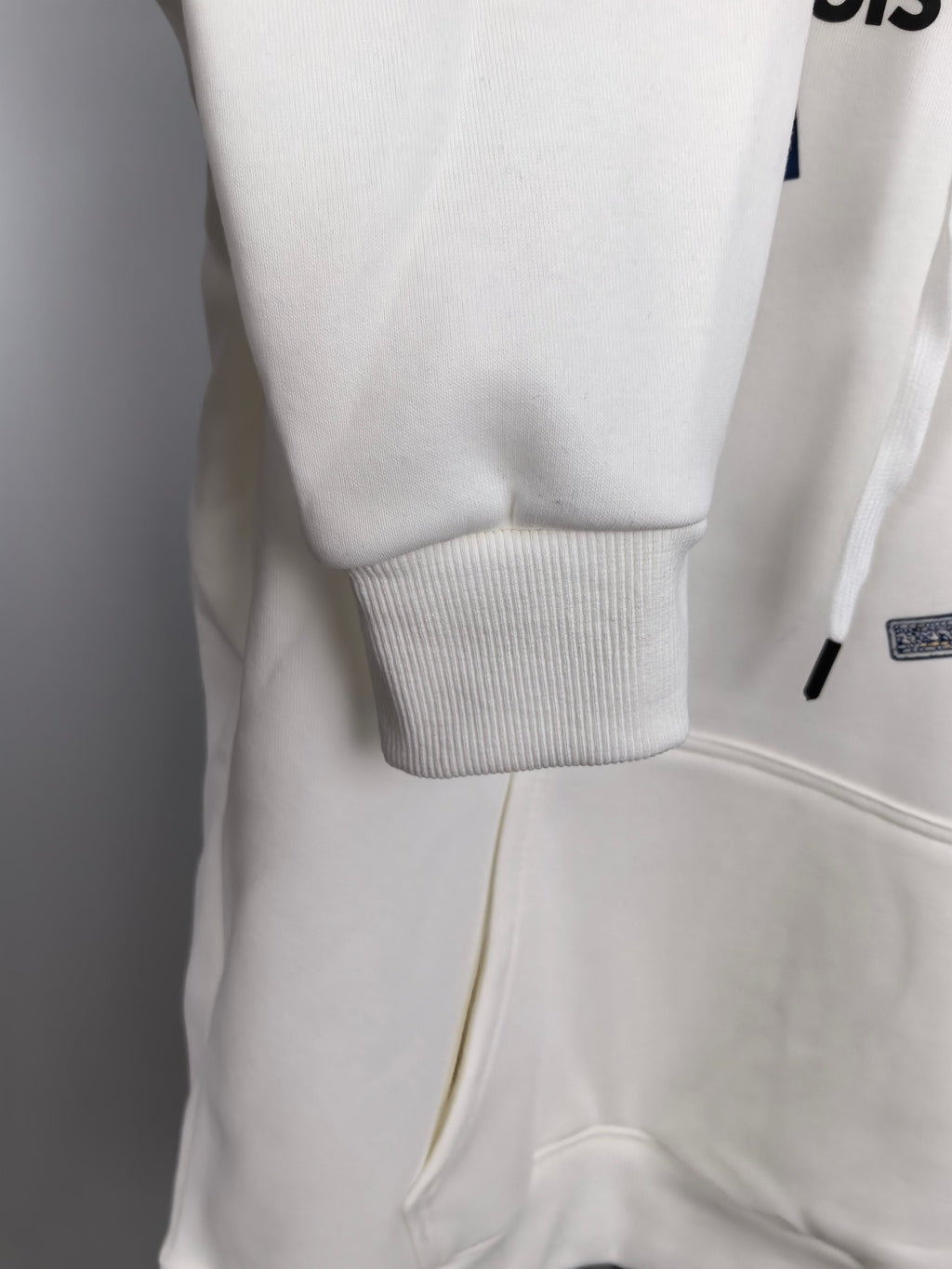 White Louis Vuitton hoodie lower front with ribbed cuff and kangaroo pocket