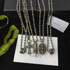 Silver-tone charm necklace set with handbag and bow charms on chain links