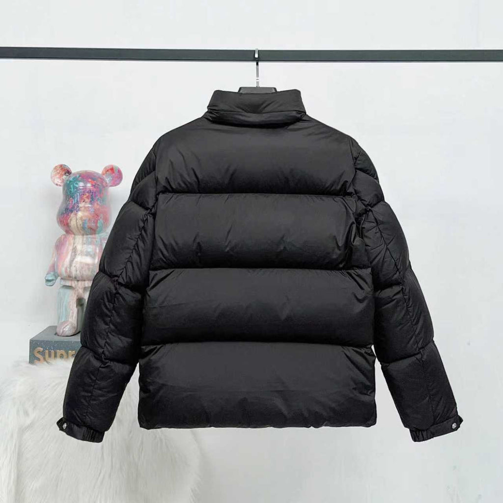 Black long puffer jacket, back view with stand collar and quilted stitching