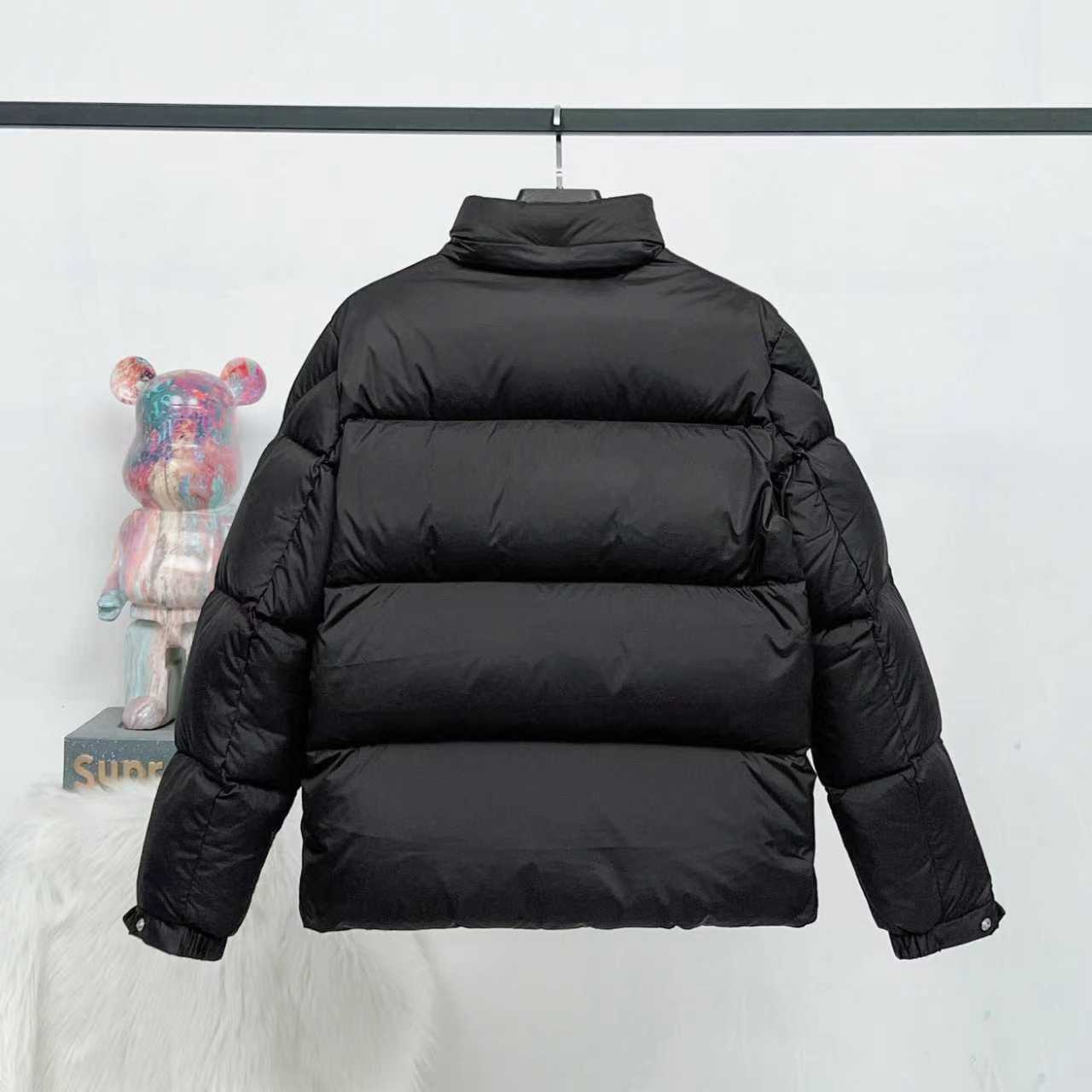 Black long puffer jacket, back view with stand collar and quilted stitching