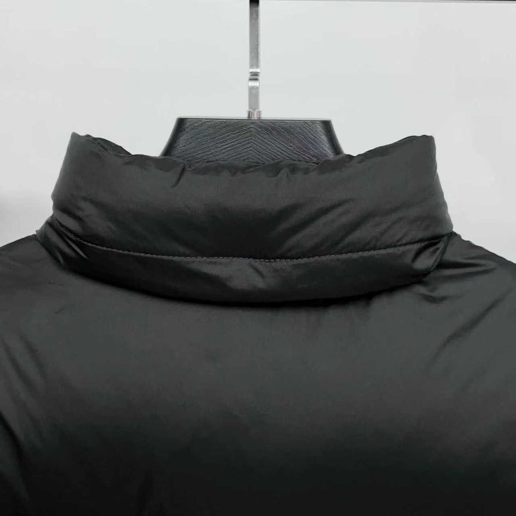 Black puffer jacket neckline with raised stand collar