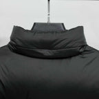 Black puffer jacket neckline with raised stand collar