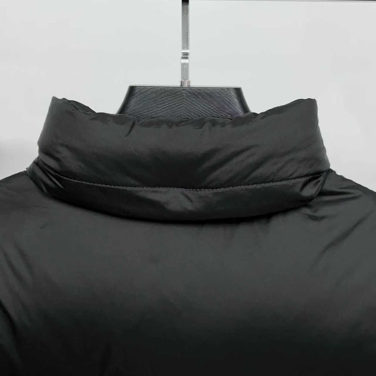 Black puffer jacket neckline with raised stand collar