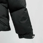 Black puffer jacket sleeve cuff with elastic trim