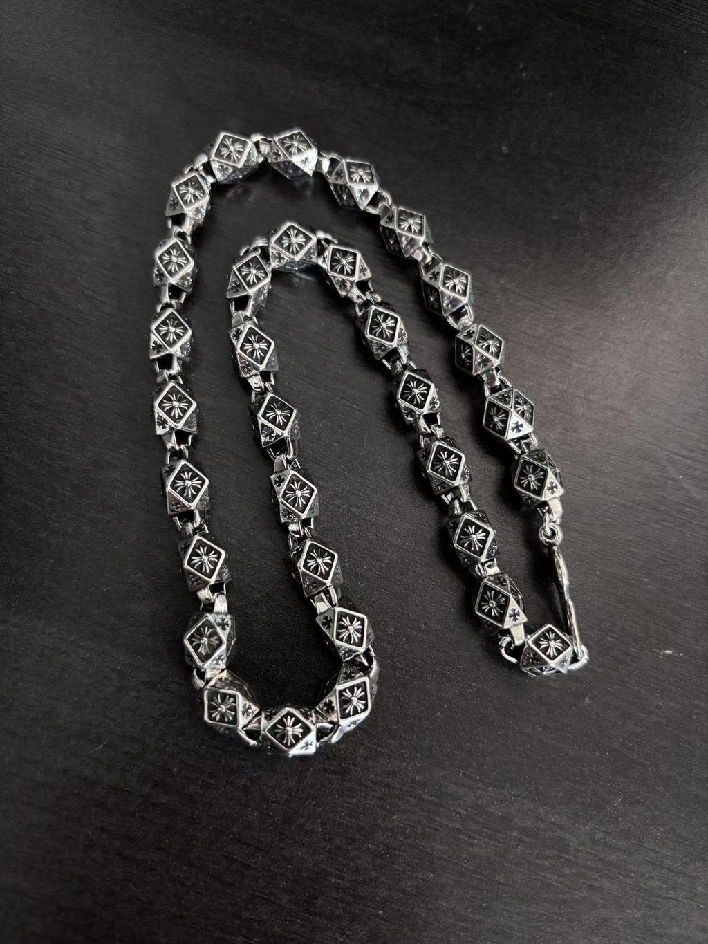 Star-motif square-link chain necklace and bracelet, silver-tone with dark accents