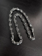Star-motif square-link chain necklace and bracelet, silver-tone with dark accents
