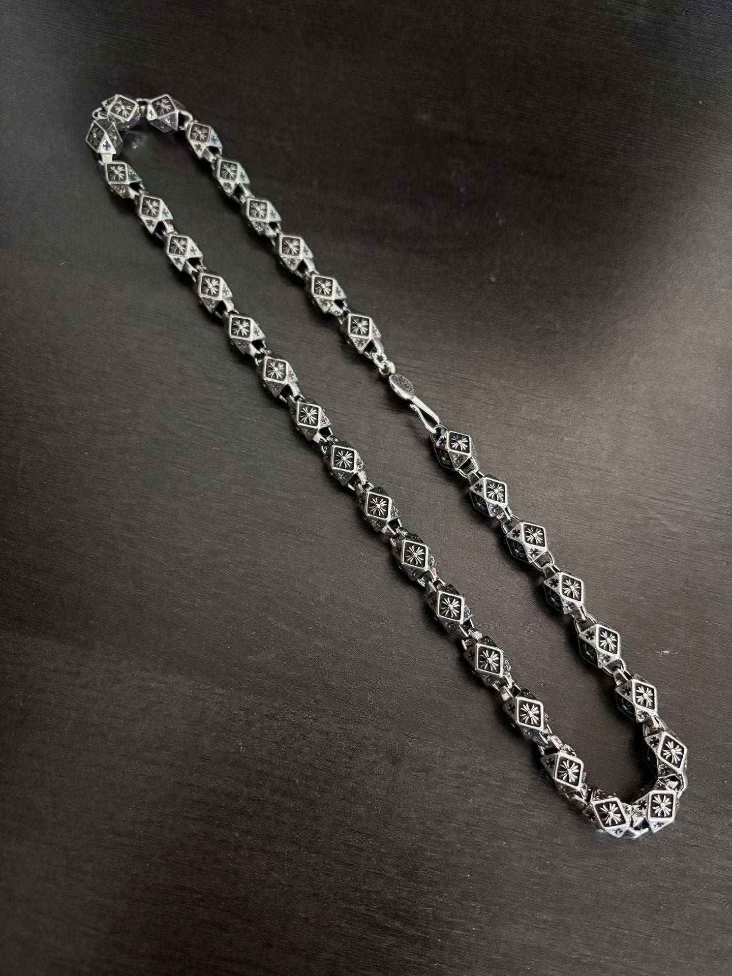 Star-motif square-link chain necklace, silver-tone with dark accents