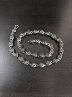 Star-motif chain necklace with square links and lobster clasp, silver-tone