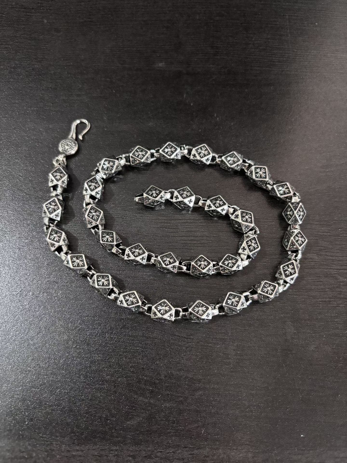 Star-motif chain necklace with square links and lobster clasp, silver-tone