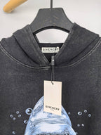Givenchy charcoal hoodie close-up of hood, drawstrings, and front graphic