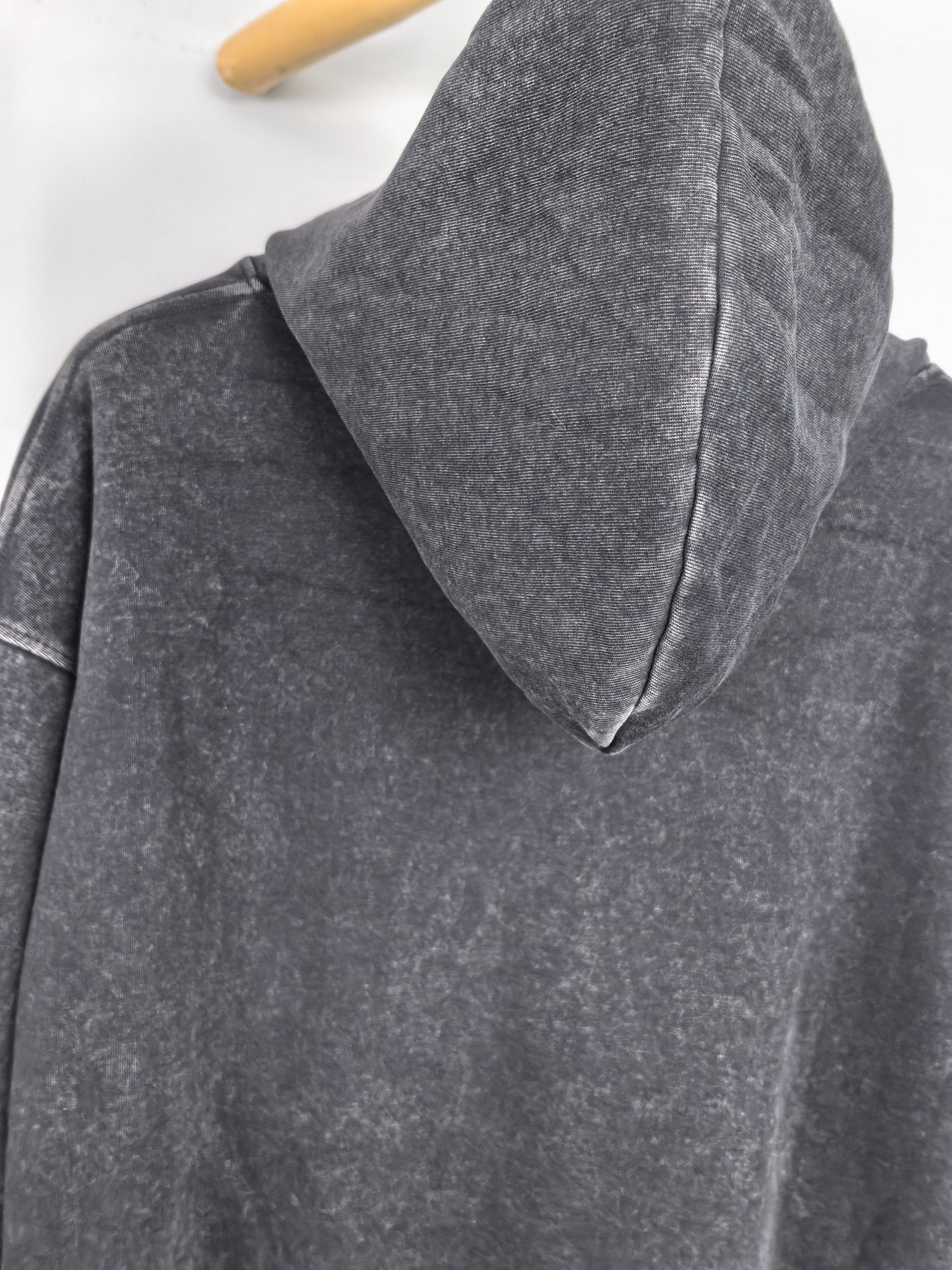 Givenchy charcoal hoodie back view with peaked hood and shoulder seam