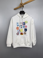White Louis Vuitton long-sleeve hoodie with multicolor logo patch graphics on front