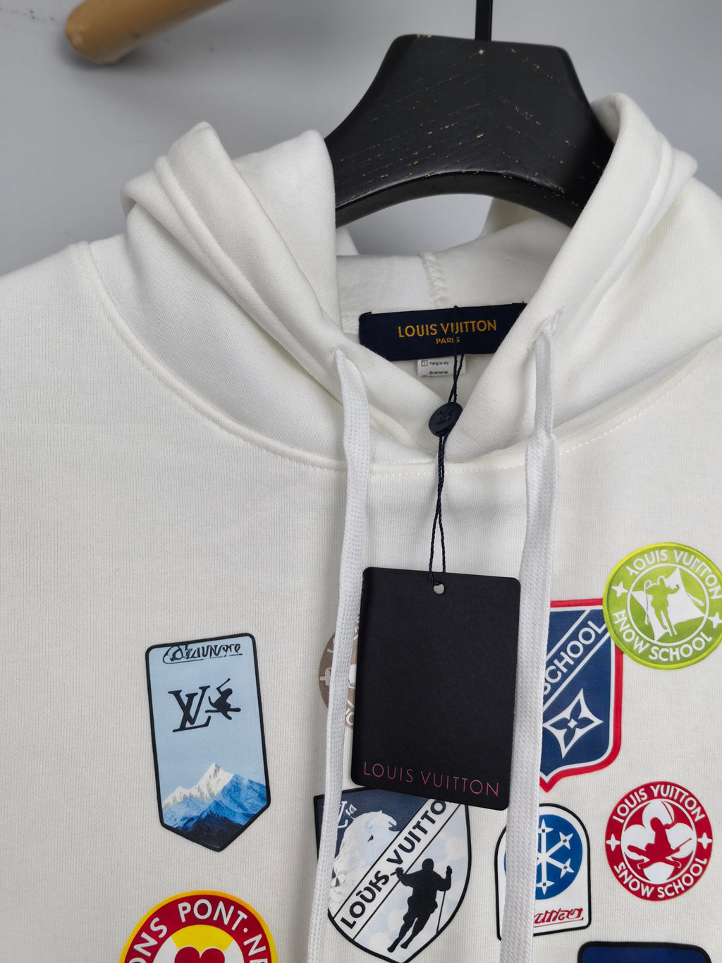 White Louis Vuitton hoodie neckline with drawstring and hanging tags