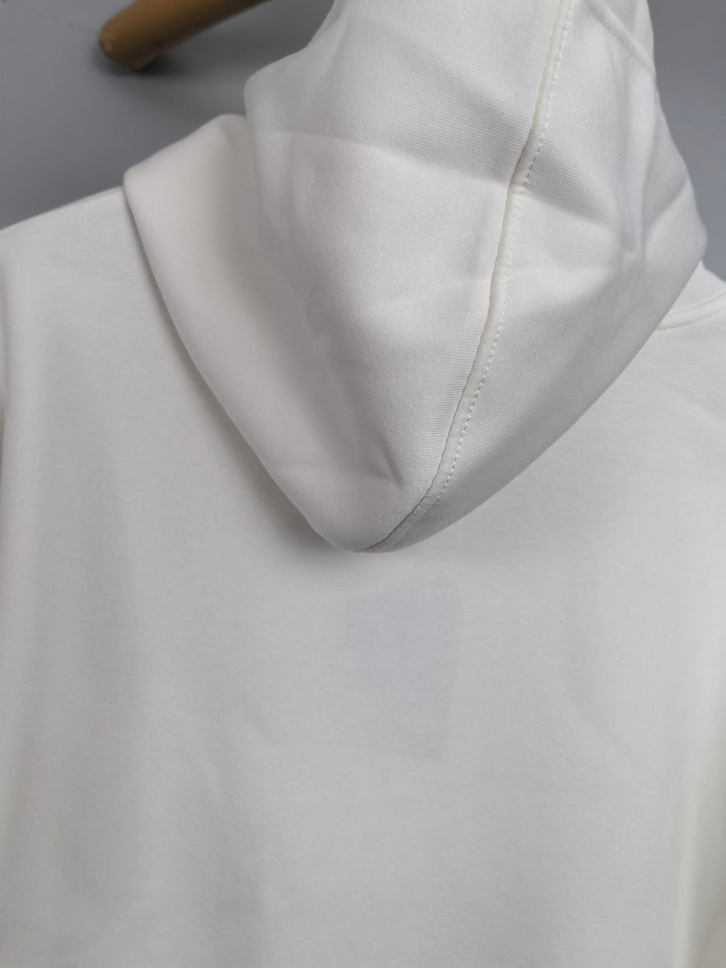 White Louis Vuitton hoodie hood and collar seam detail