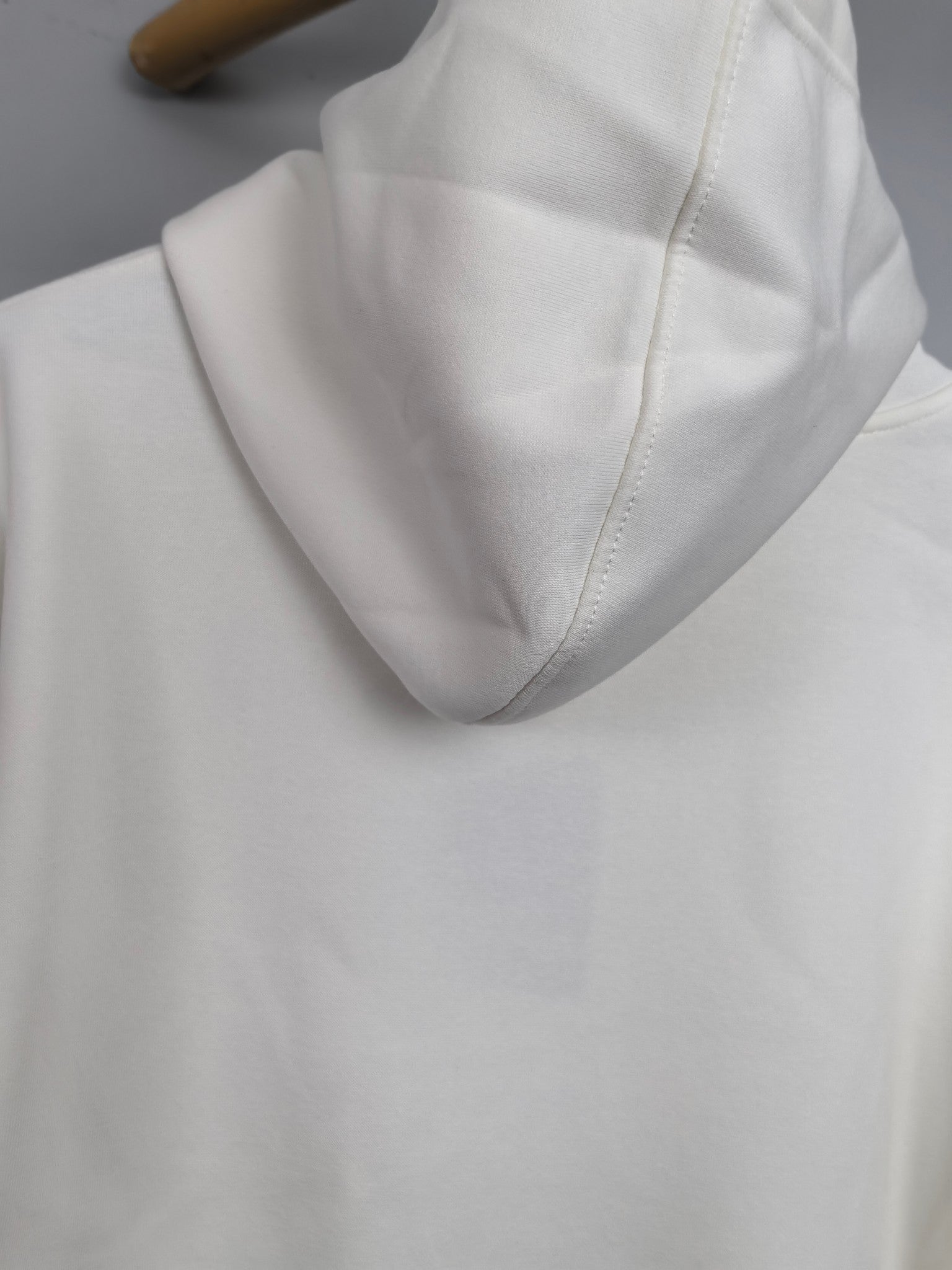 White Louis Vuitton hoodie hood and collar seam detail