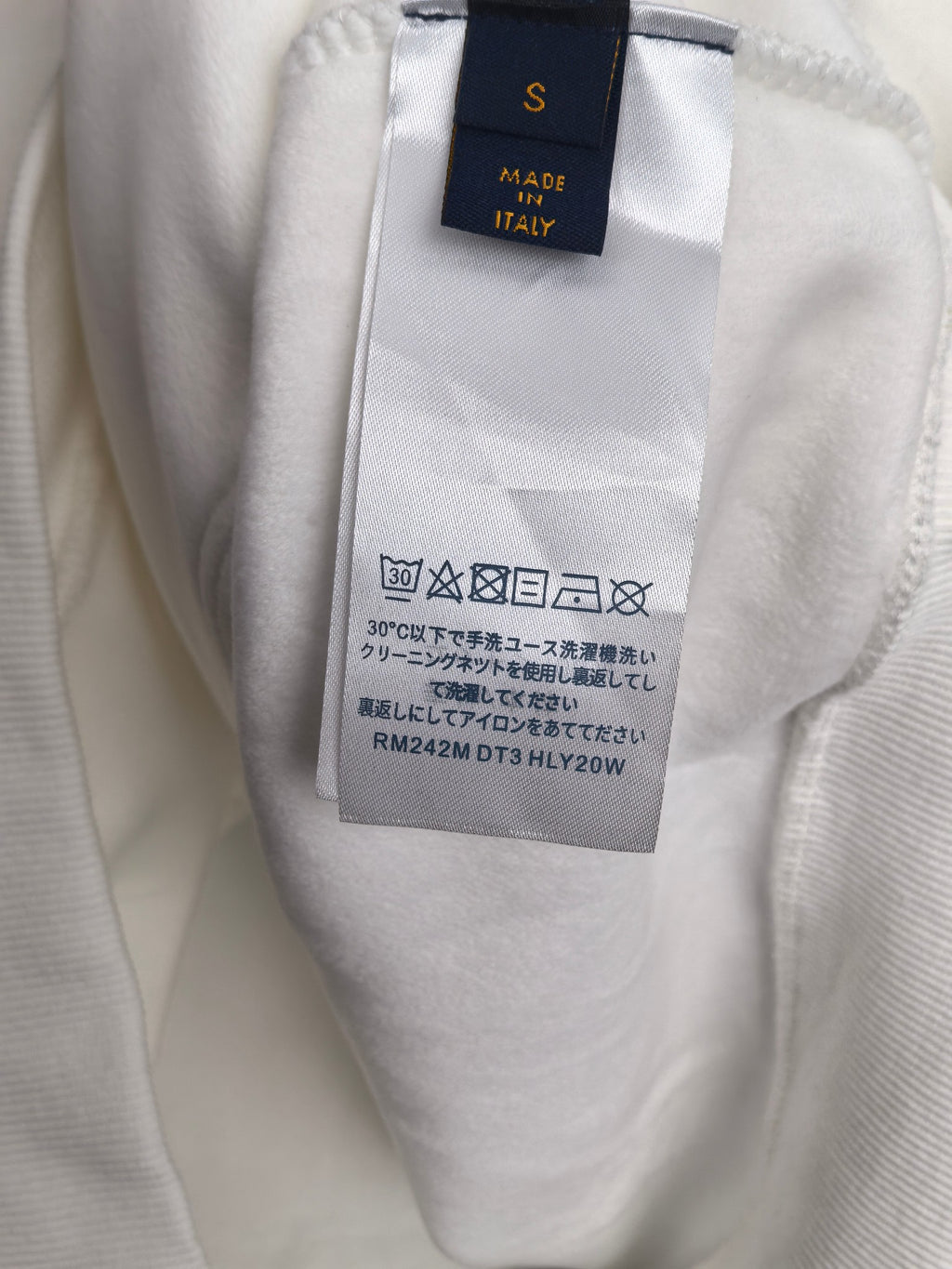 Louis Vuitton hoodie interior care label with 'Made in Italy' text