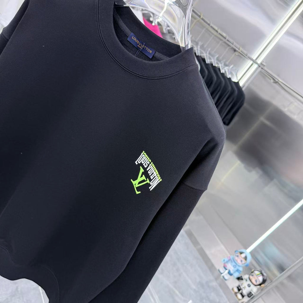 Black Louis Vuitton crewneck sweatshirt close-up of neon chest logo