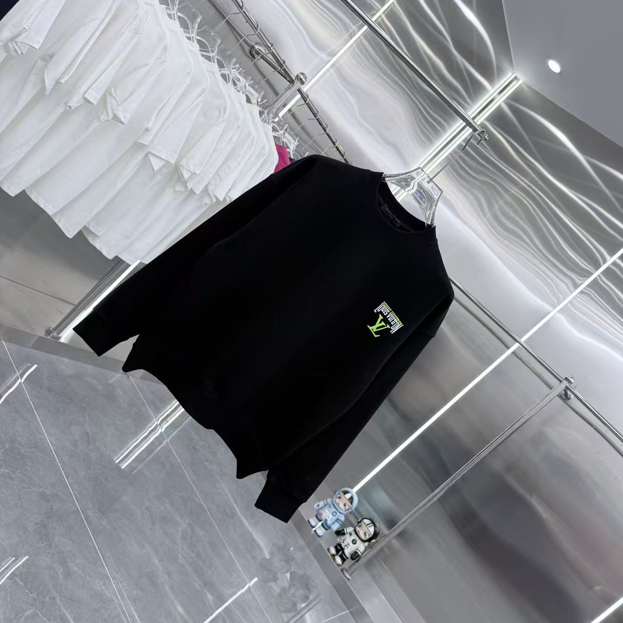 Black Louis Vuitton crewneck sweatshirt on hanger, small neon logo on chest