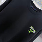 Black Louis Vuitton crewneck sweatshirt close-up of ribbed collar and logo