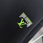Black Louis Vuitton logo patch in green and white on sweatshirt
