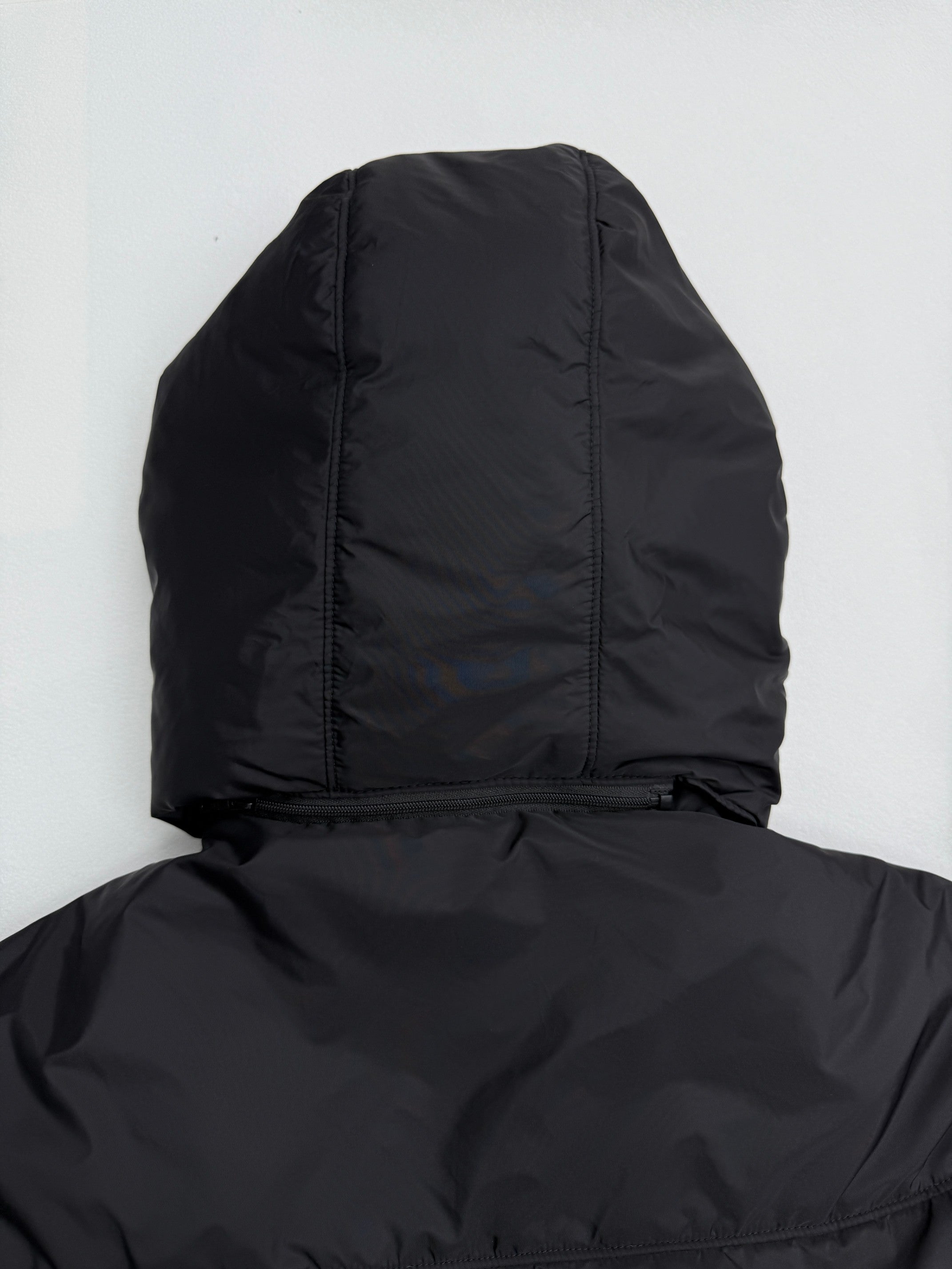Prada hooded puffer jacket back view with hood, dark black