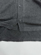 Heather gray polo shirt lower placket with two buttons and side pocket