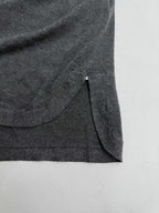 Heather gray polo shirt side hem with stitched seam and drape detail