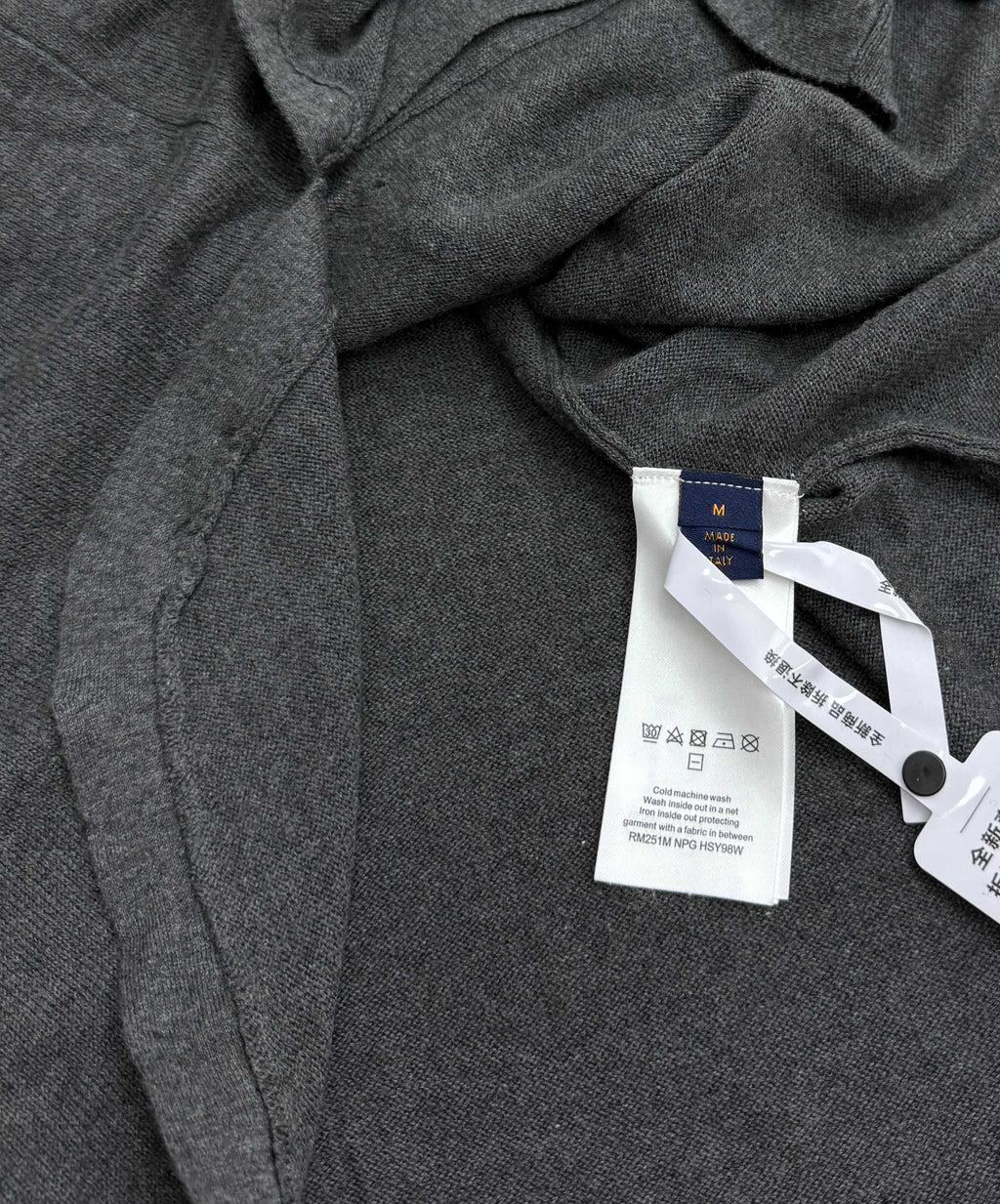 Heather gray polo shirt interior neck label with size tag and care sticker
