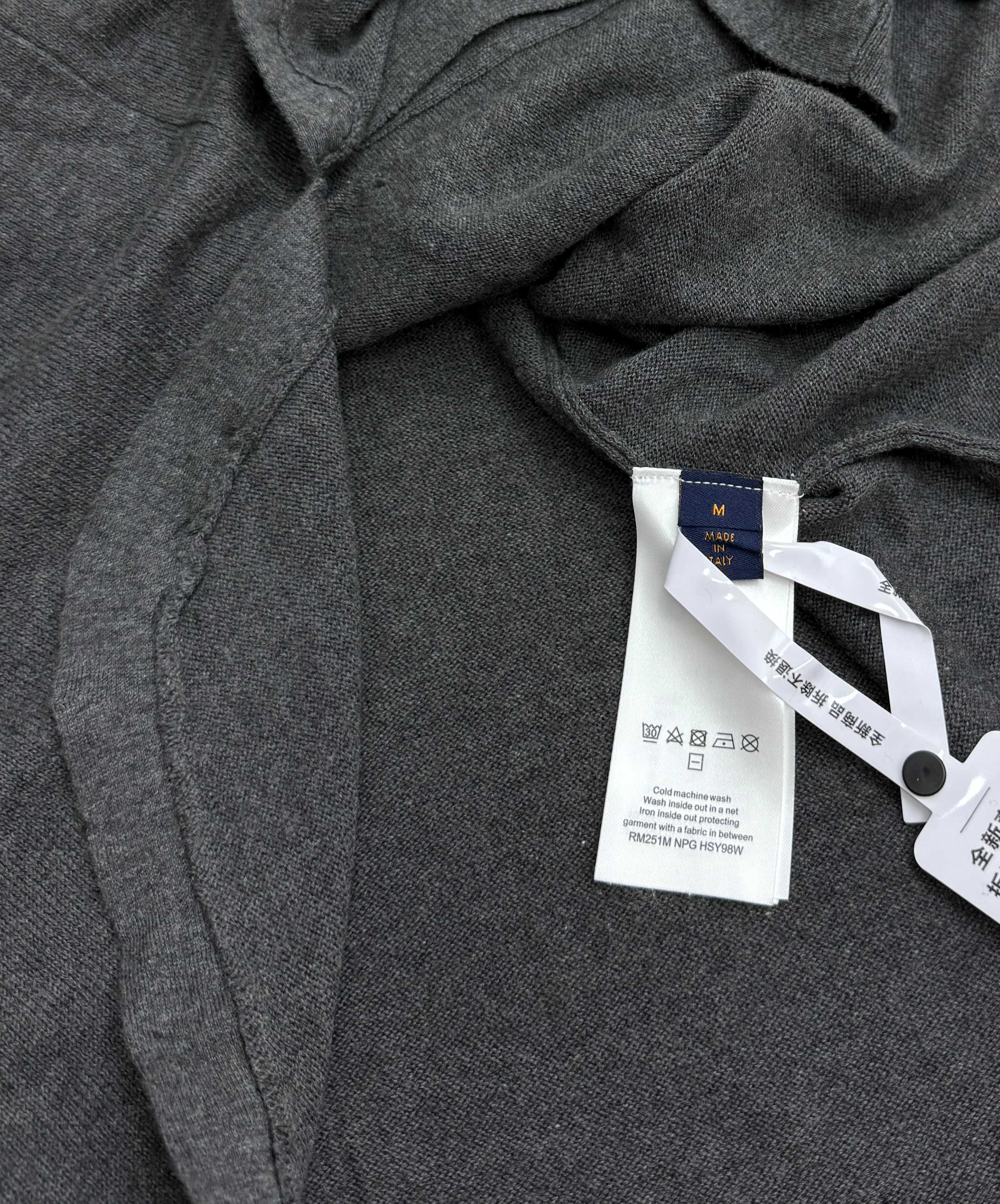 Heather gray polo shirt interior neck label with size tag and care sticker
