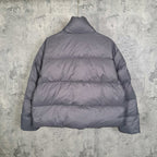Gray Balenciaga puffer jacket back view with stand collar and quilted panels.