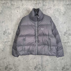 Gray Balenciaga puffer jacket with hood, full-zip front, chest logo.