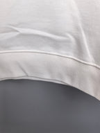 White sweatshirt hem with ribbed trim detail