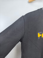 Fendi dark gray sweatshirt sleeve with partial yellow Fendi logo