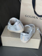 Golden Goose light blue sneakers from heel view, lace-up with white midsoles
