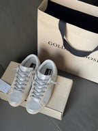 Golden Goose pair of light blue lace-up sneakers with white soles and padded collars