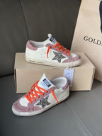 Golden Goose low-top sneakers on box, white and mauve with orange laces, glitter star
