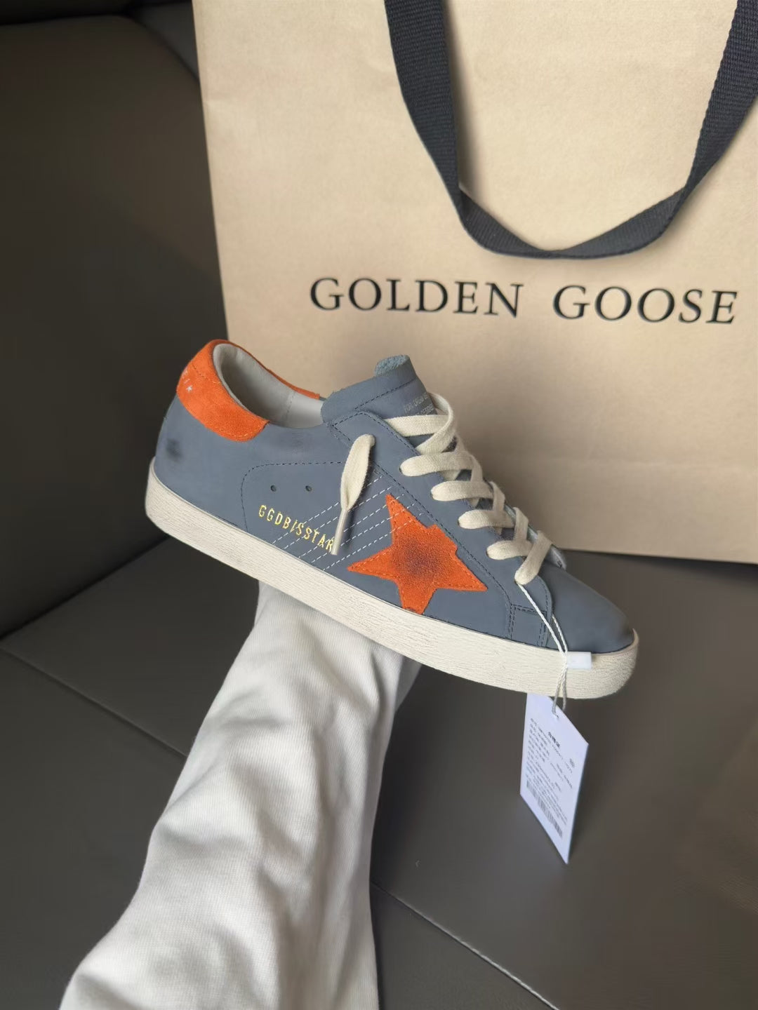 Light blue low-top sneakers with orange star patch, Golden Goose, white sole