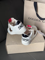 White leather sneakers with black star logo and leopard side panel
