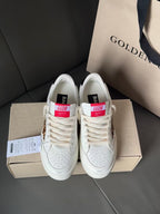 White leather sneakers pair with red and blue tongue labels