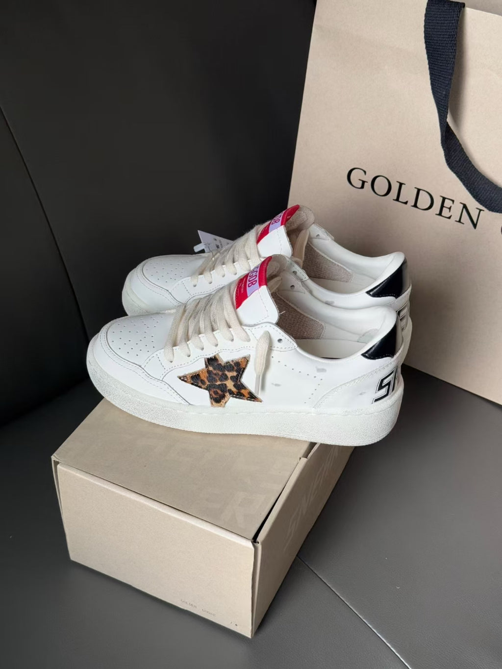 White leather sneakers with leopard patch and chunky sole