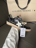 Low-top sneakers, dark navy with white star and lace-up front, gum rubber sole