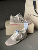Golden Goose low-top sneakers, light gray with metallic star patches and pink sole stripe