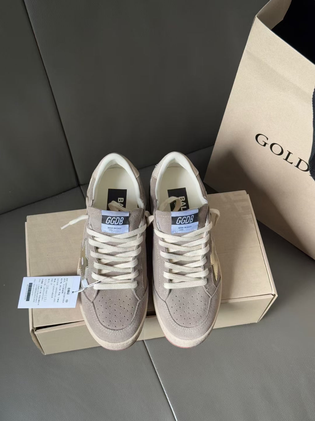 Golden Goose low-top sneakers, light gray uppers with white laces and perforated toe