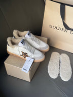 Golden Goose white sneakers with leopard side patch, tan sole, and plush sherpa shoe liners